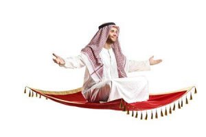 7288016-une-personne-arab-assis-sur-un-tapis-volant-isolé-sur-fond-blanc-.jpg