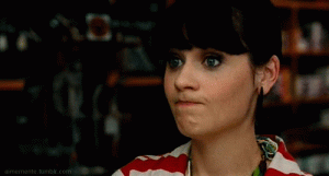 Zooey-Deschanel-Awkwardly-Watching-The-Situation-On-New-Girl.gif