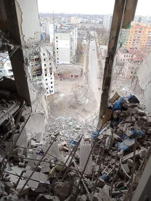 residential apartment, after it and the surrounding street was all severely damaged by Russian...jpg