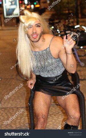 stock-photo-muscular-trans-person-with-beard-and-blonde-wig-1230015130.jpg