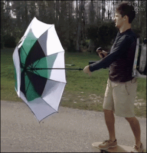 Skateboarding-leaf-blower-umbrella.gif